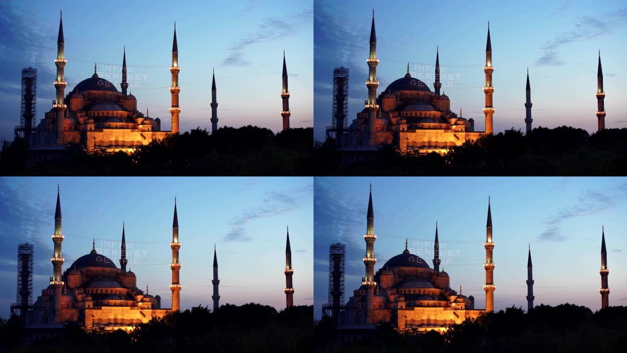 在黄昏时放大泛光的蓝色清真寺外观