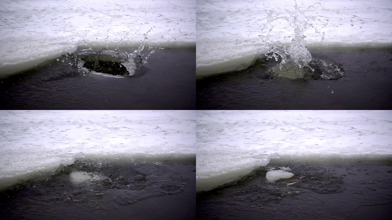 将冰块倒入冰冻的河流中的慢动作