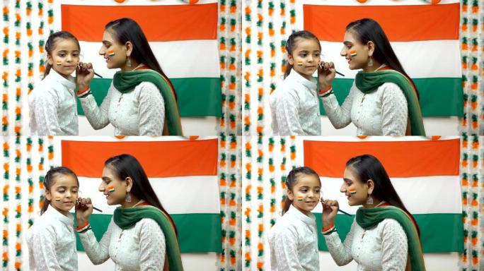 印度妇女用国旗三色画小女孩的脸-独立日/共和国日概念
