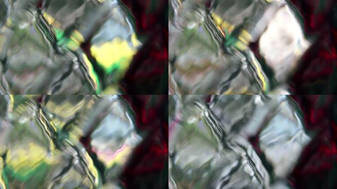 菱形金刚石图案玻璃表面的抽象彩色反射