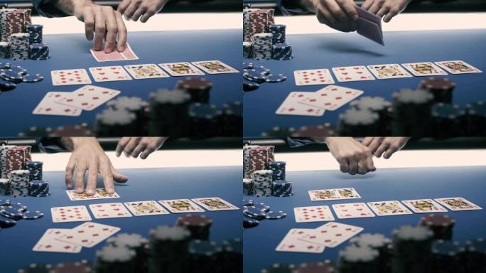 幸运的扑克玩家在桌子上露出他的牌
