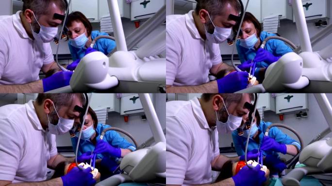 牙医和护士治疗患者的蛀牙