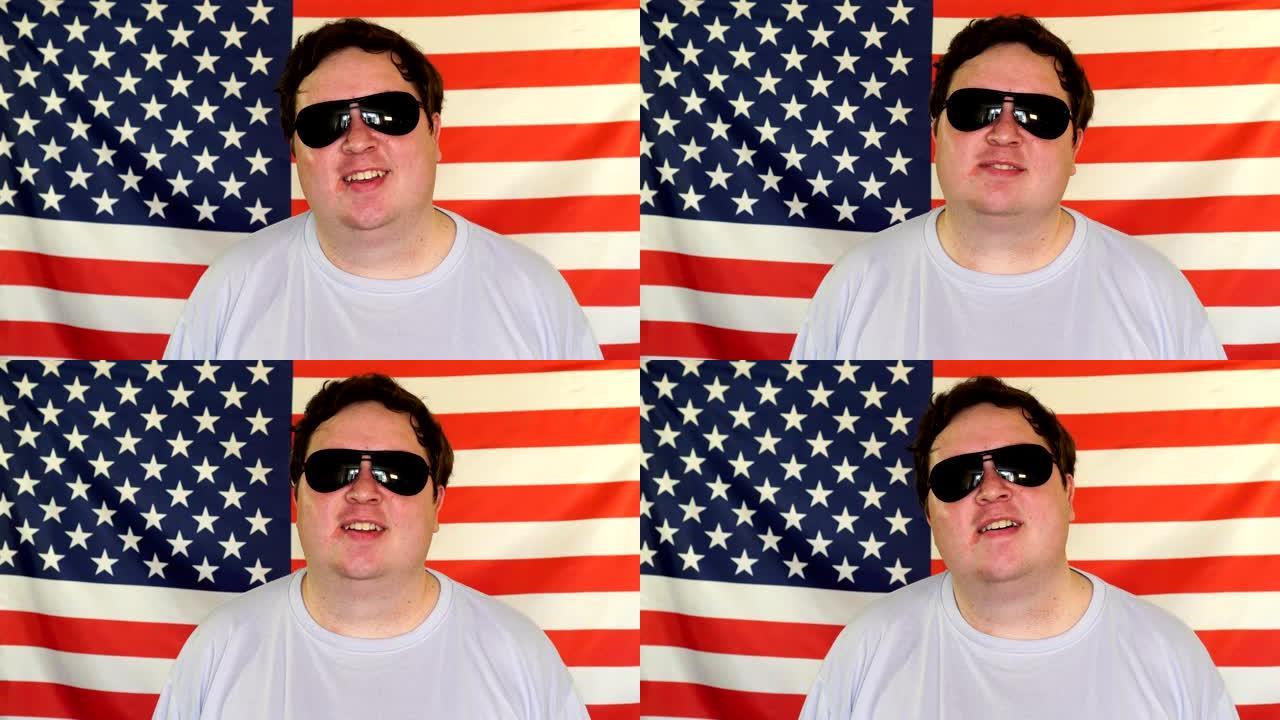 美国国旗背景上一个戴着太阳镜的自信男人的肖像