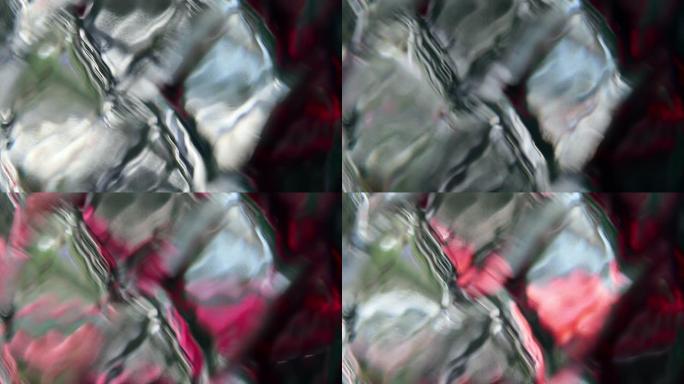 菱形金刚石图案玻璃表面的抽象彩色反射