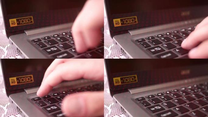 手指按下带有红色二进制覆盖的高清笔记本电脑上的逃生按钮