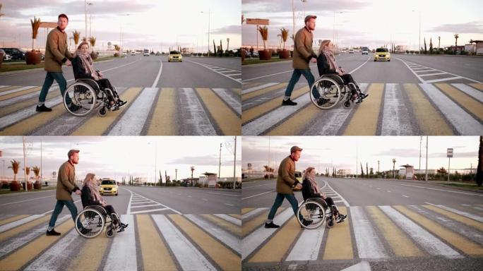 男子正在城市人行横道上运送残疾妇女