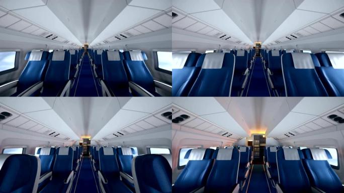 乘客坐在座位上的现代飞机的内部。现代飞机内部的空飞机座椅。