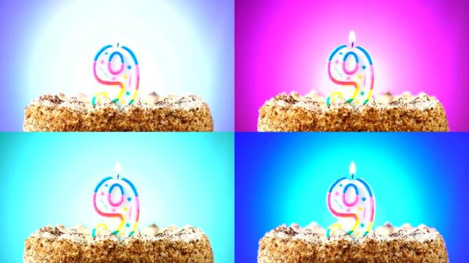 带有燃烧的生日蜡烛的生日蛋糕。9号。背景改变颜色