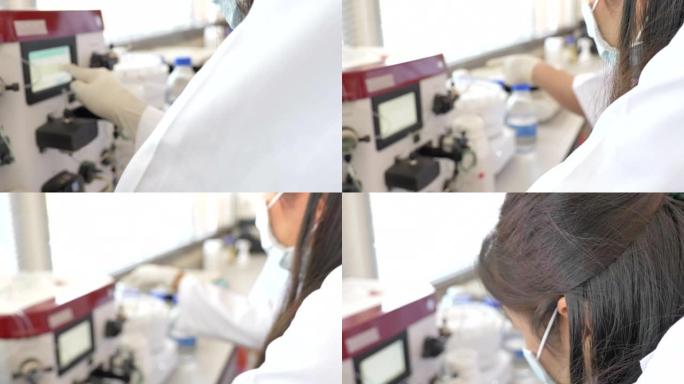 两名科学家在实验室工作的场景使用蛋白质纯化机，概念科学和技术在实验室