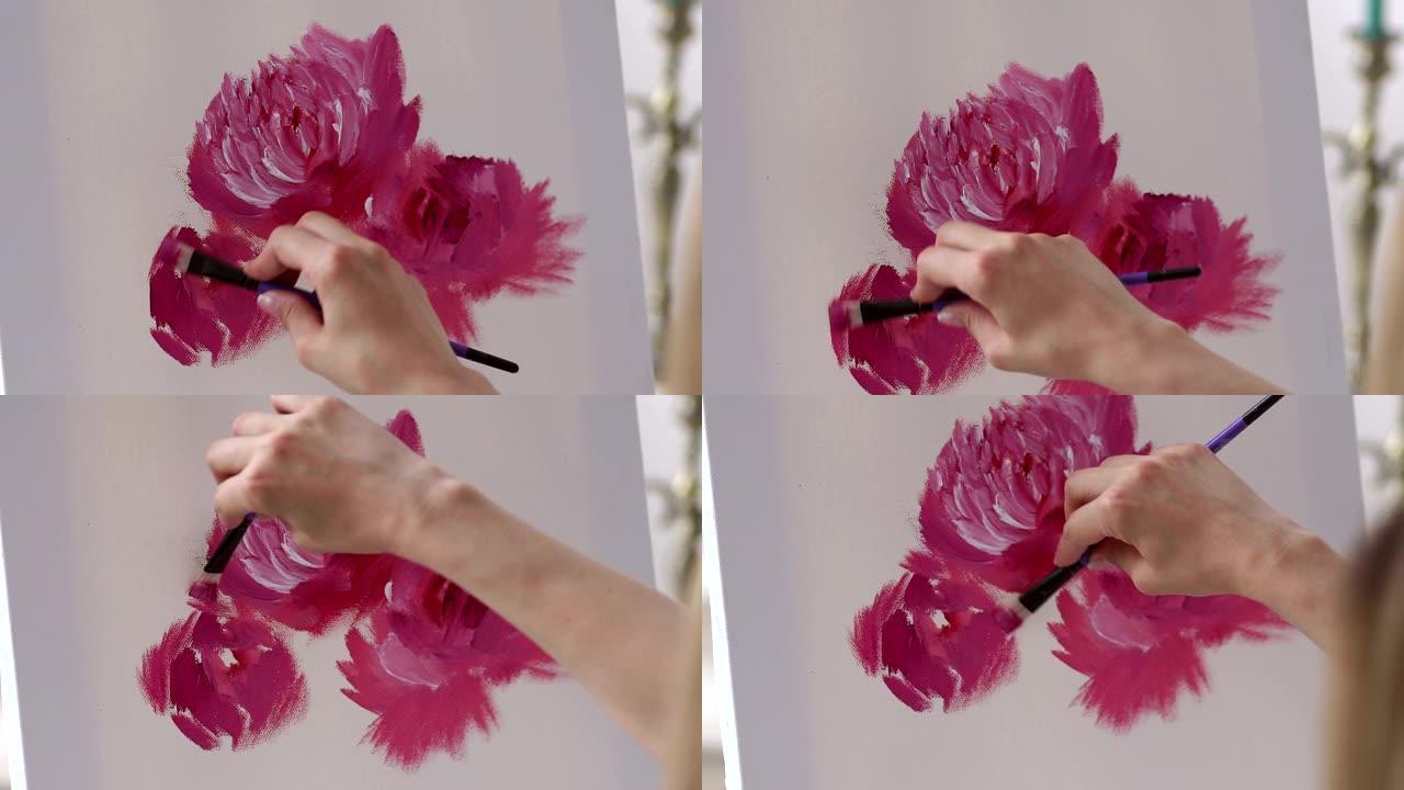 女艺术家的特写在白色画布上画粉红色的花朵。