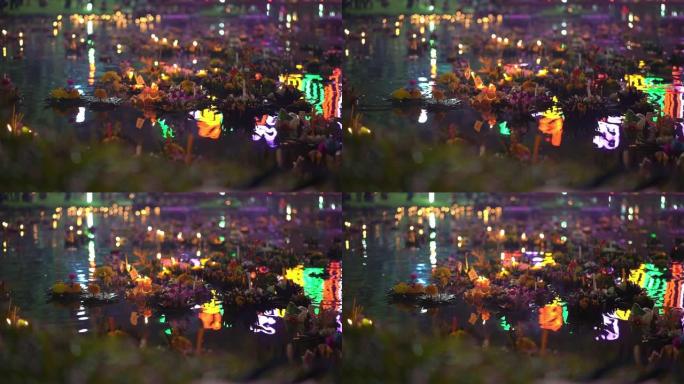 许多漂浮在水面上的克拉通的慢镜头。庆祝泰国传统节日-Loy kathong