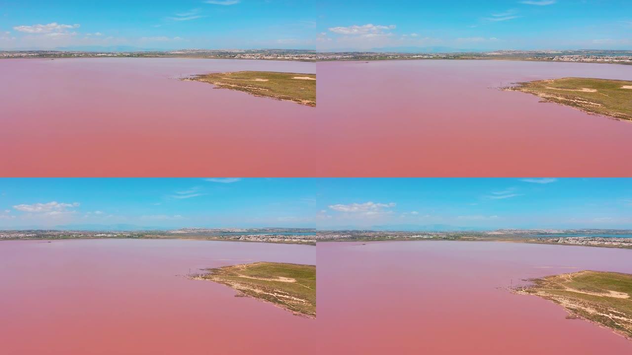 拉斯萨利纳斯全景鸟瞰图视频，亮色著名的粉红湖。托雷维耶哈市和地中海的海岸线。科斯塔布兰卡。阿利坎特省