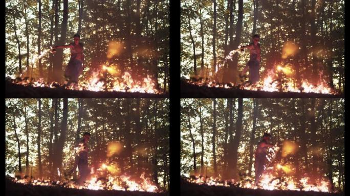艺术家在树林中洒下火，超慢动作