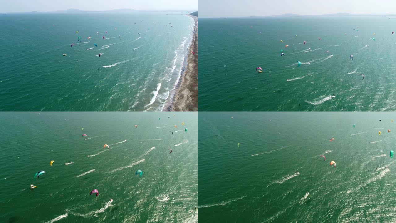 在海岸线上风筝冲浪赛船会的鸟瞰图，绿松石水，比赛，水上运动，事件，赛车，极限运动，冒险，旅游目的地，