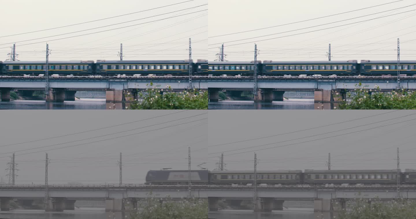 绿皮列车驶过火车过桥