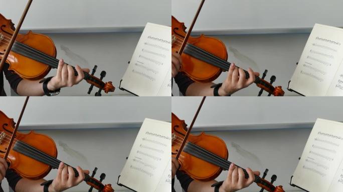 小提琴老师拉小提琴，拉土耳其风格的小提琴，