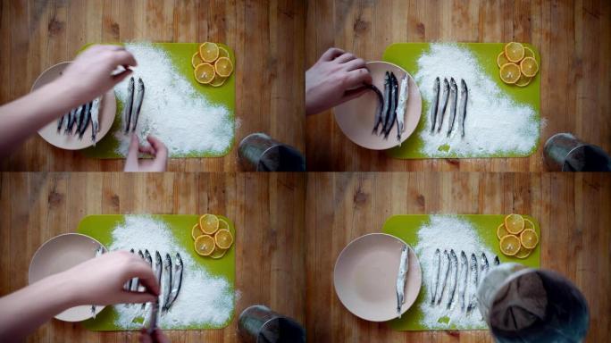 烹饪小鱼的过程，准备在煎锅中用油煎炸
