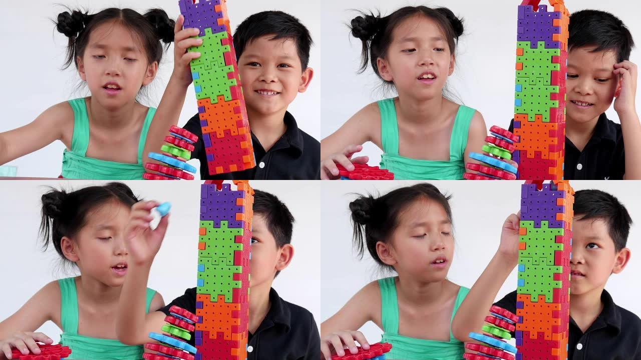 亚洲儿童玩益智塑胶块创意游戏练习身心技能