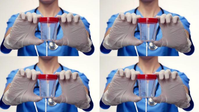 医生在他的手拿容器分析尿液或精子在医学实验室的研究。用于分析的医疗容器(库)。医学及卫生保健