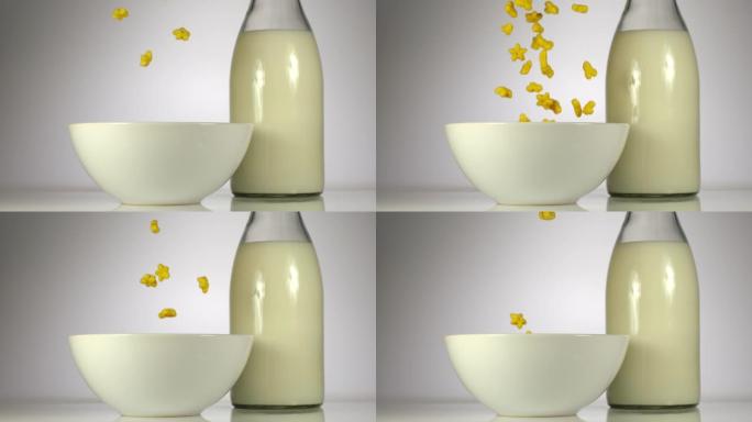 慢动作: 儿童玉米片落在桌子上牛奶附近的白色盘子里