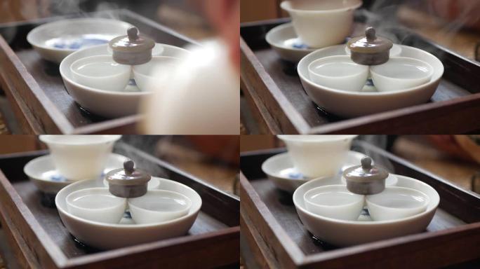 茶师傅在茶道前洗和温暖茶杯。中国传统功夫或功夫茶道。中国传统文化的元素。特写。4k