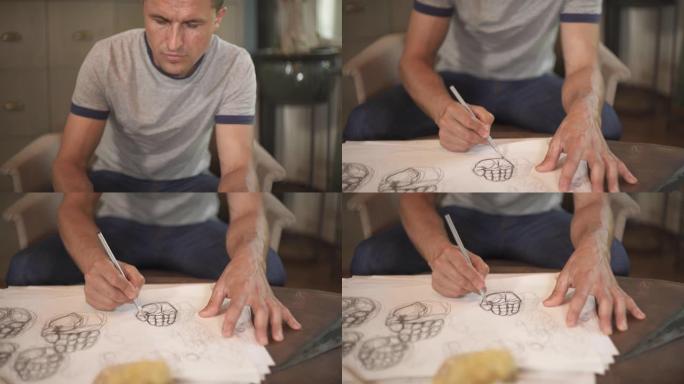 一位专业才华横溢的艺术家用铅笔绘制人类手掌的草图的顶部底部照片。在艺术工作室工作。工作和爱好概念