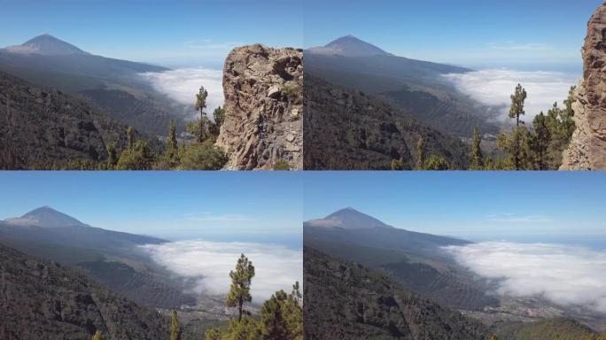 Teide火山和云层的空中全景覆盖了西班牙加那利群岛特内里费岛的Puerto de la Cruz和