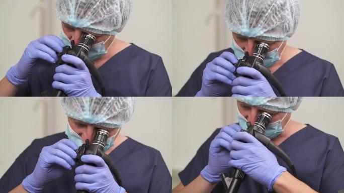 使用内窥镜进行胃镜检查的专业男性医生的特写镜头。诊断医疗程序