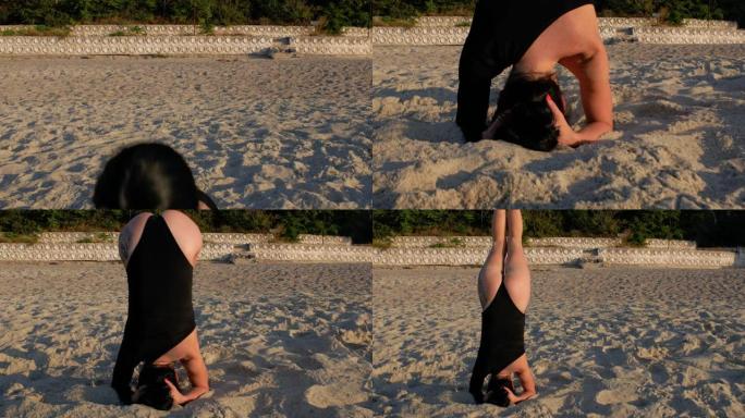 穿着黑色紧身衣的女人在日出时在美丽的海滩上靠海做瑜伽练习。健身、运动、瑜伽和健康生活理念。4k. 4
