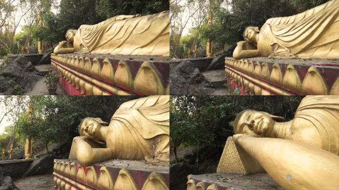 老挝琅勃拉邦Phou Si山上的金色睡佛雕像的慢镜头视频。