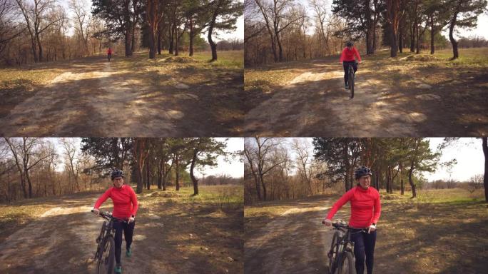 主题运动员的健康问题。骑山地自行车的白人女子自行车手在森林里完成锻炼。情绪疲惫，用力快速心跳，呼吸困