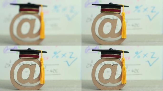留学教育理念: 电子邮件地址符号和毕业帽公式算术方程背景用铅笔，在线/电子学习数学知识的成功概念