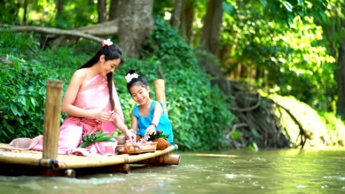 4k美丽妈妈微笑着和女儿在河边玩耍