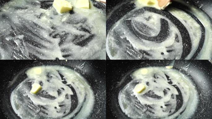 在带有不粘涂层的煎锅上涂黄油。在厨房射击。