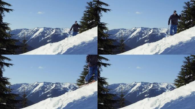 男子劈开登上雪山山脊蓝天背景