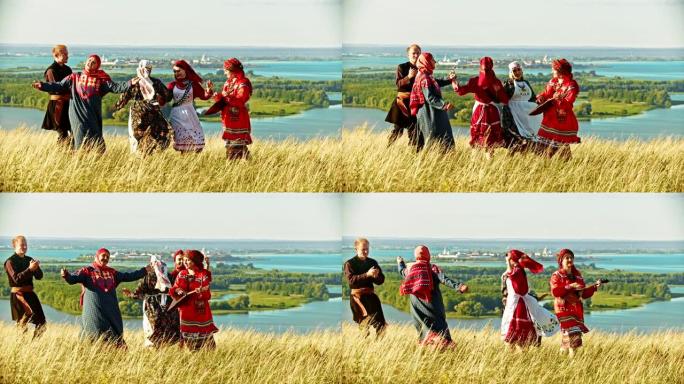 穿着传统俄罗斯服装的人们在巴拉莱卡的音乐下在球场上跳舞。