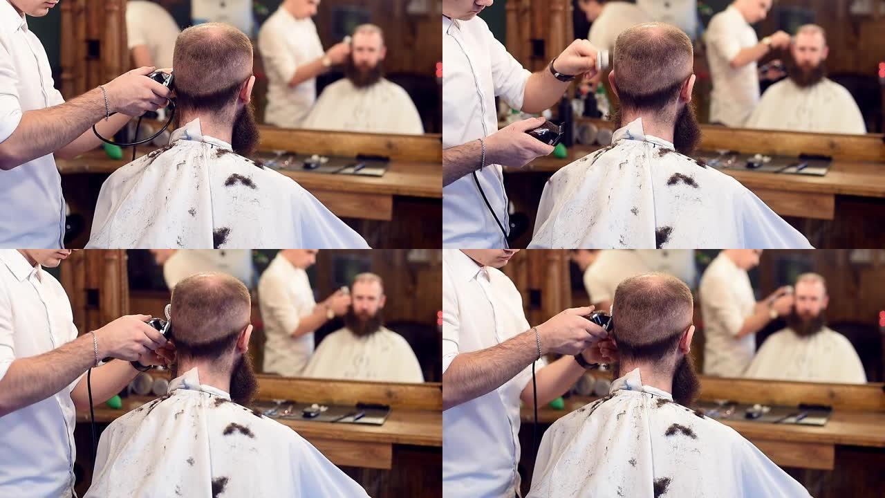 剪发的年轻理发师用修剪器和刷子剪发，客户坐在镜子前，反射模糊