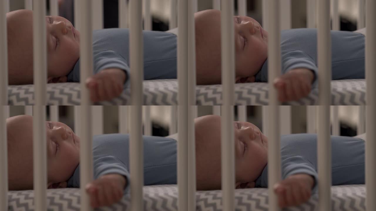 一个小男孩平静地睡在婴儿床里的特写视频。快乐的童年概念。感人时刻
