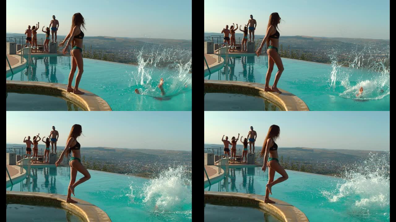 女人在聚会上在游泳池里推男人，超慢动作