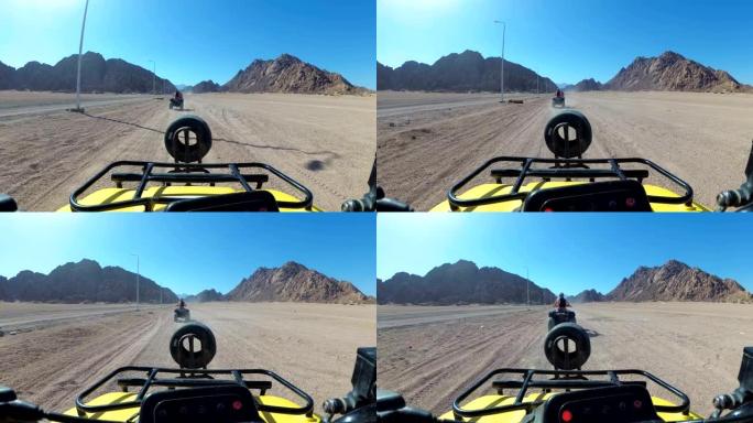 在埃及的沙漠里骑四轮摩托。第一人称视角。骑全地形车