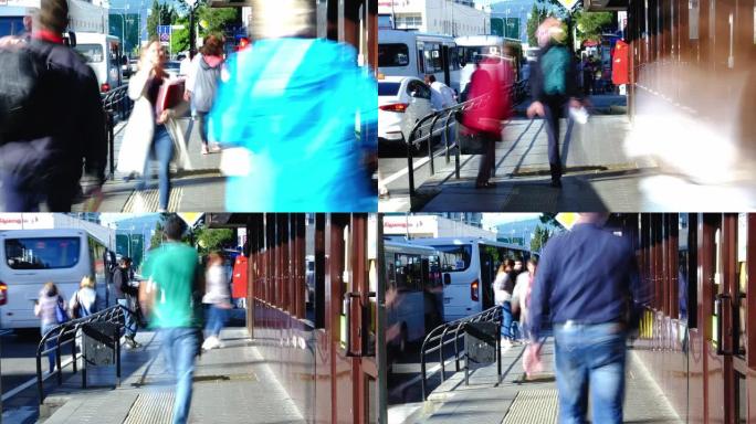 延时视频拍摄。人行道上激烈移动的行人。人行横道。公共交通站。变焦相机。城市生活。