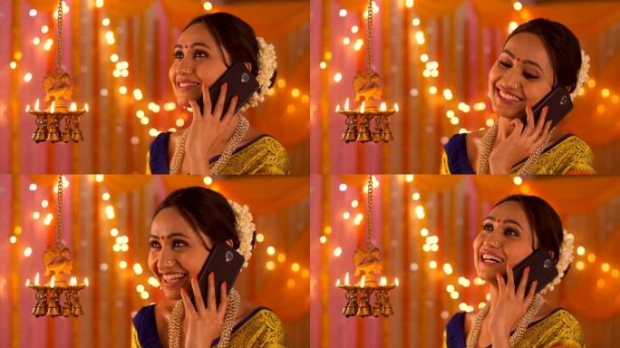 印度美女在电话里聊天diya-排灯节在家中的场景