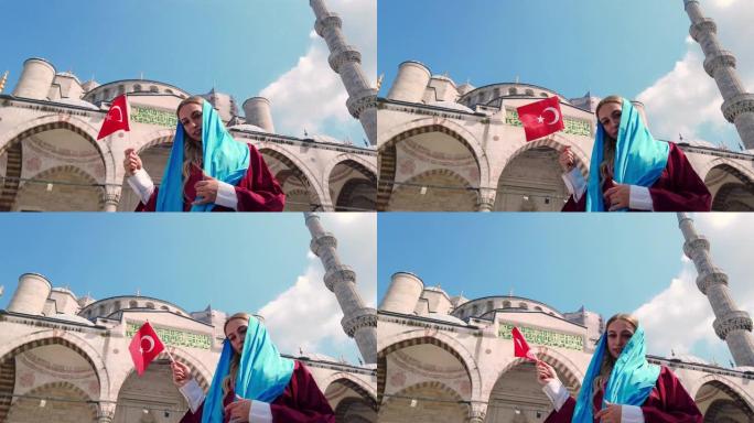 穿着衬衫的漂亮女孩挥舞着土耳其国旗