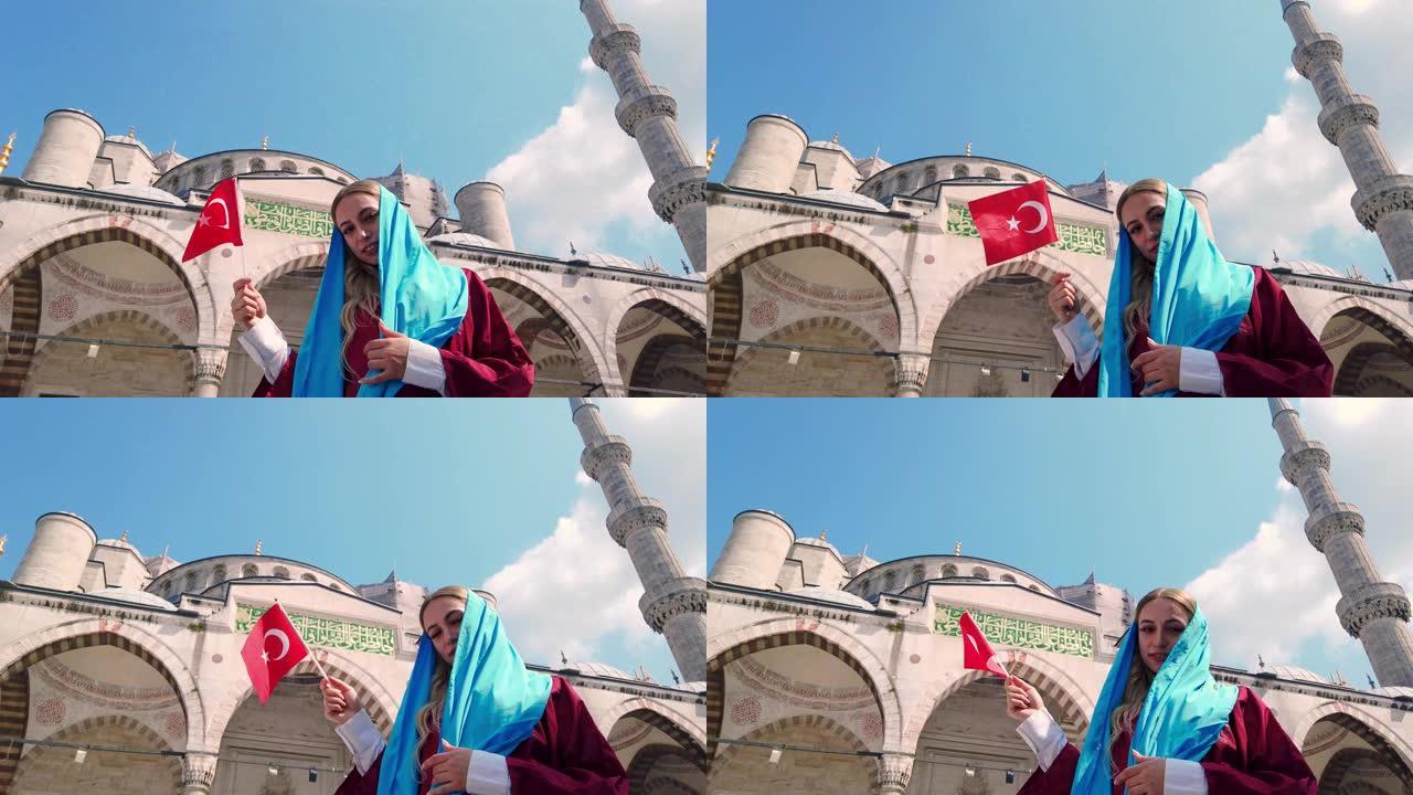 穿着衬衫的漂亮女孩挥舞着土耳其国旗