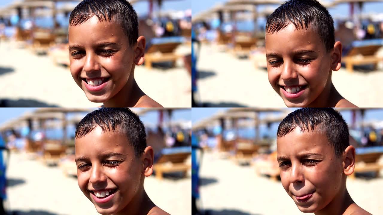 沙滩上的帅哥看着相机微笑，孩子被夏日的阳光，电影的dop弄晕了