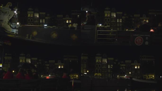 夜间的观光船和建筑物
