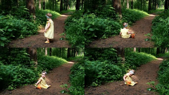 橙色桶有趣的女孩坐在棕色森林小径上