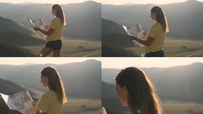女游客站在悬崖边上，手里拿着地图，寻找旅行路线