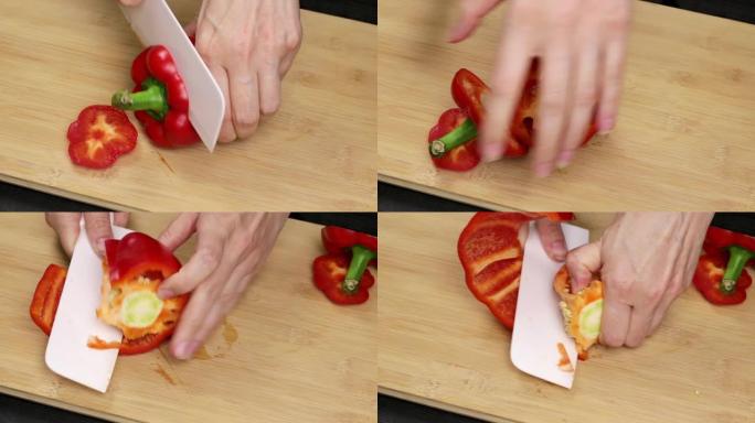 大红甜椒被分离出来，核心被去除。厨师将一把刀握在女性手中，切一种健康的蔬菜。关闭
