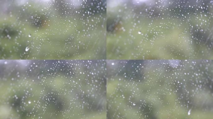 场景慢动作雨滴在车外玻璃车上背景